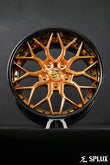Porsche Cayman custom wheels in Piano Black and Polished Copper