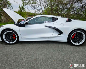 C8 Corvette parked with the SA-03 wheels visible, the aggressive directional spokes catching the light