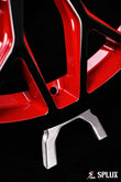 Close-up of the SC-14M forged wheel's piano black barrel and red accent spokes on the Corvette C8