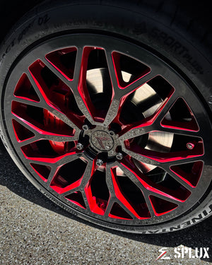 Rear view of the black Corvette C8 with SC-14M forged wheels, staggered 20-inch front and 21-inch rear, custom center caps