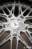 Camaro ZL1 rims with white hardware around the center cap