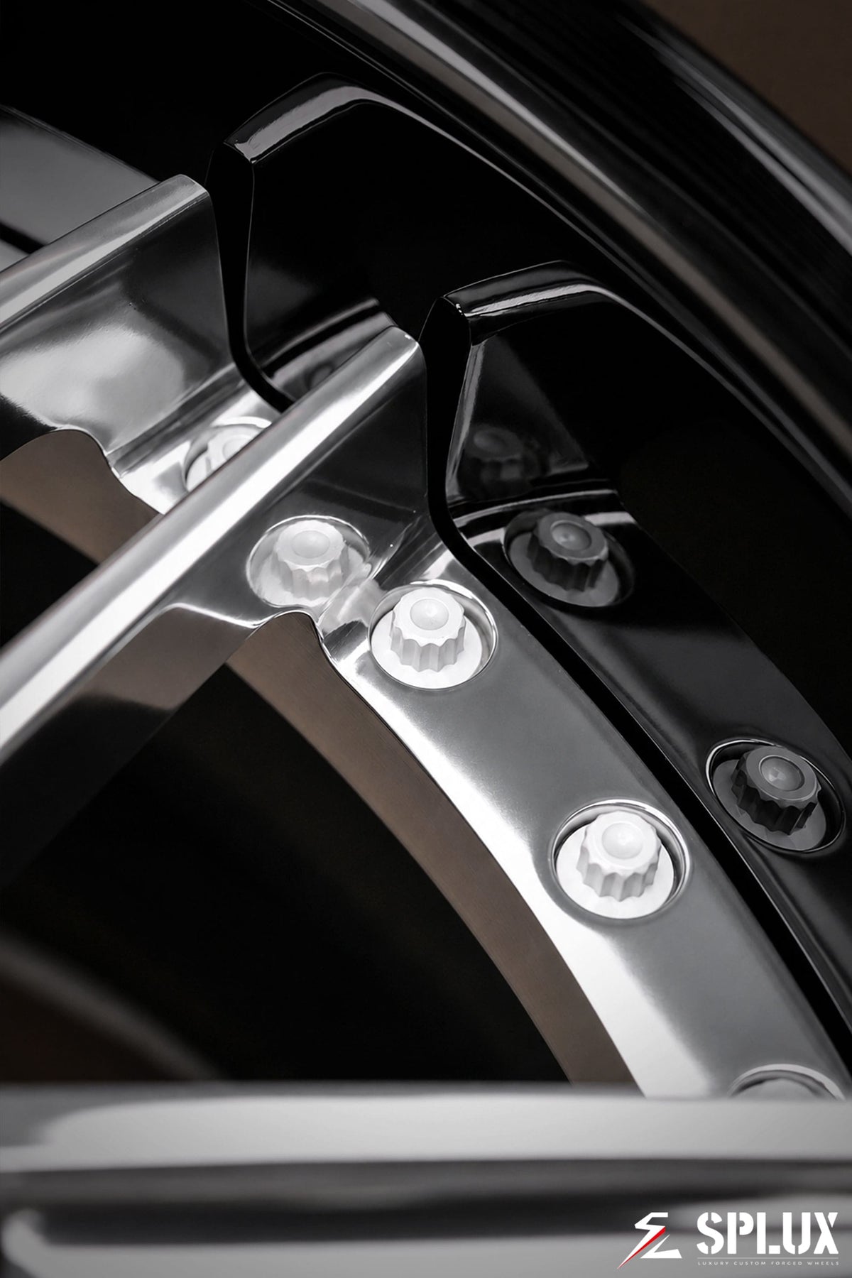 Polished aluminum spokes contrasted against a piano black barrel