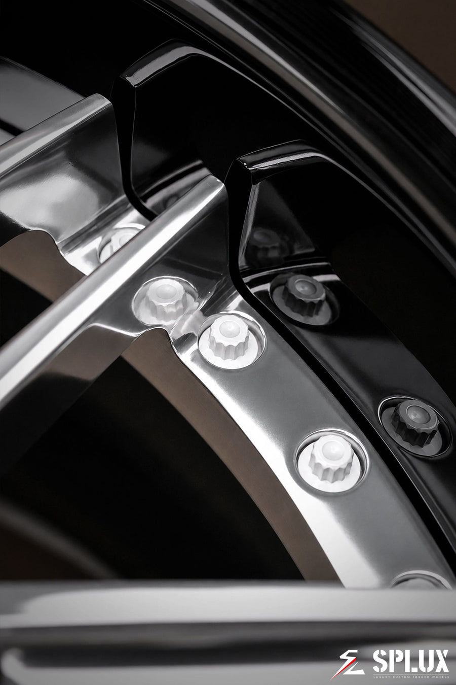 Polished aluminum spokes contrasted against a piano black barrel