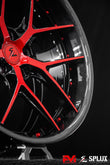 Red Corvette wheels with a carbon fiber lip and gloss red hardware