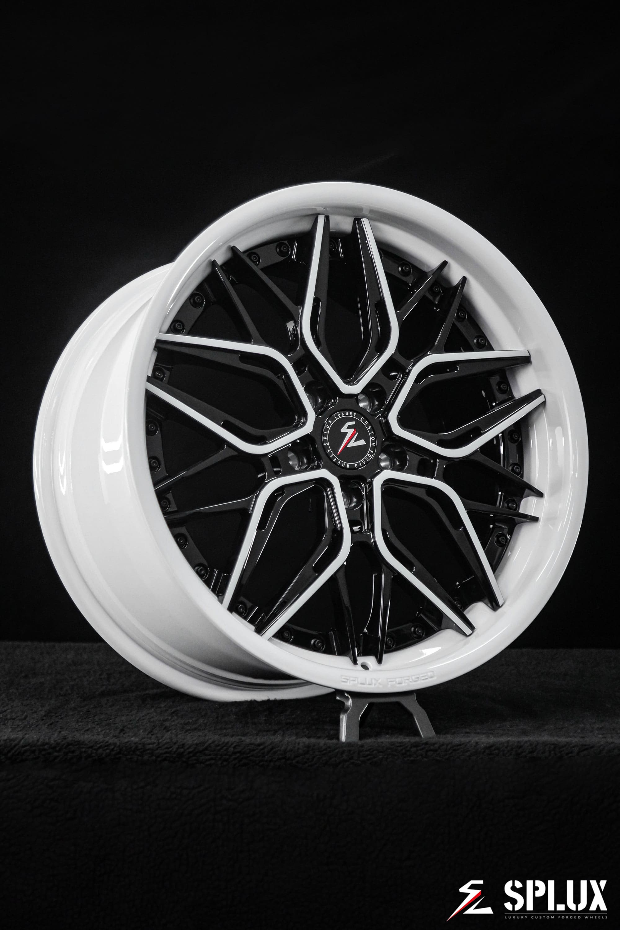 C8 Corvette with black rims and piano black spokes with ivory trim