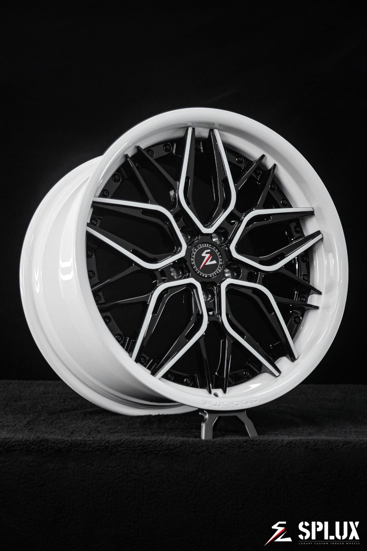 C8 Corvette with black rims and piano black spokes with ivory trim