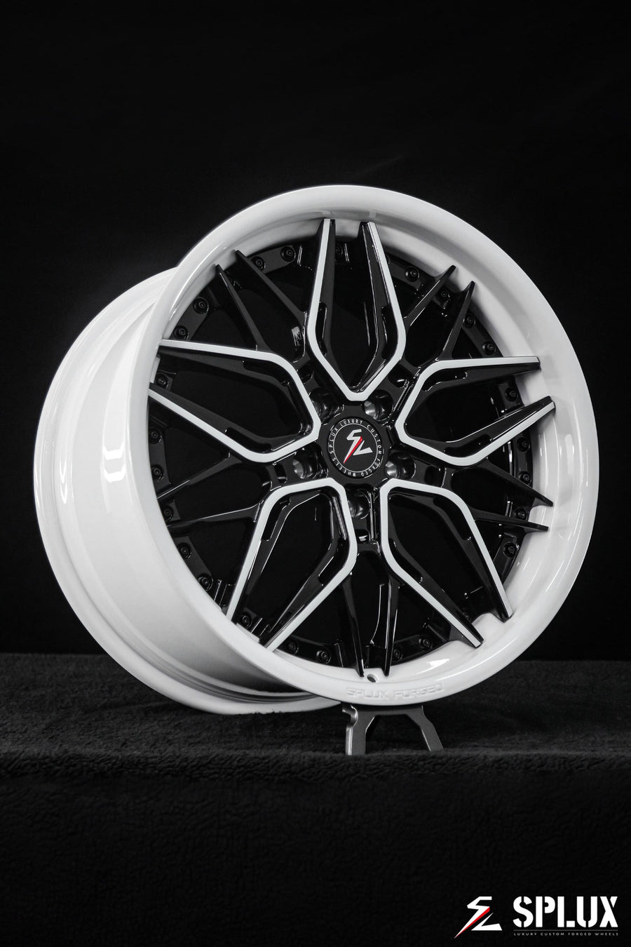 C8 Corvette with black rims and piano black spokes with ivory trim