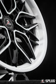 White Corvette wheels with a deep concave spoke profile