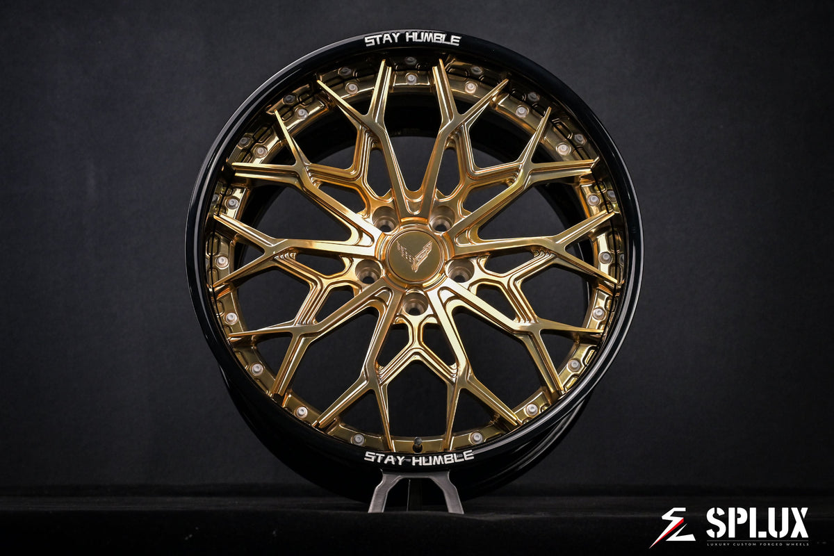 Close-up of the SD-08 wheel showing the deep-dish barrel in piano black and gold spokes