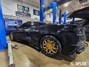 Black C8 Stingray with SD-08 forged wheels showing deep dish and multi-spoke design in gold and black