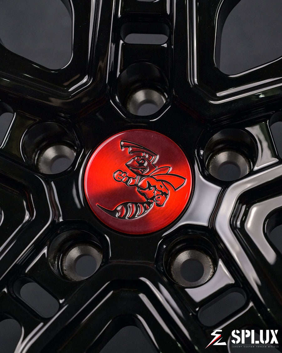 dodge challenger custom wheels close-up with brushed red barrel and chrome hardware