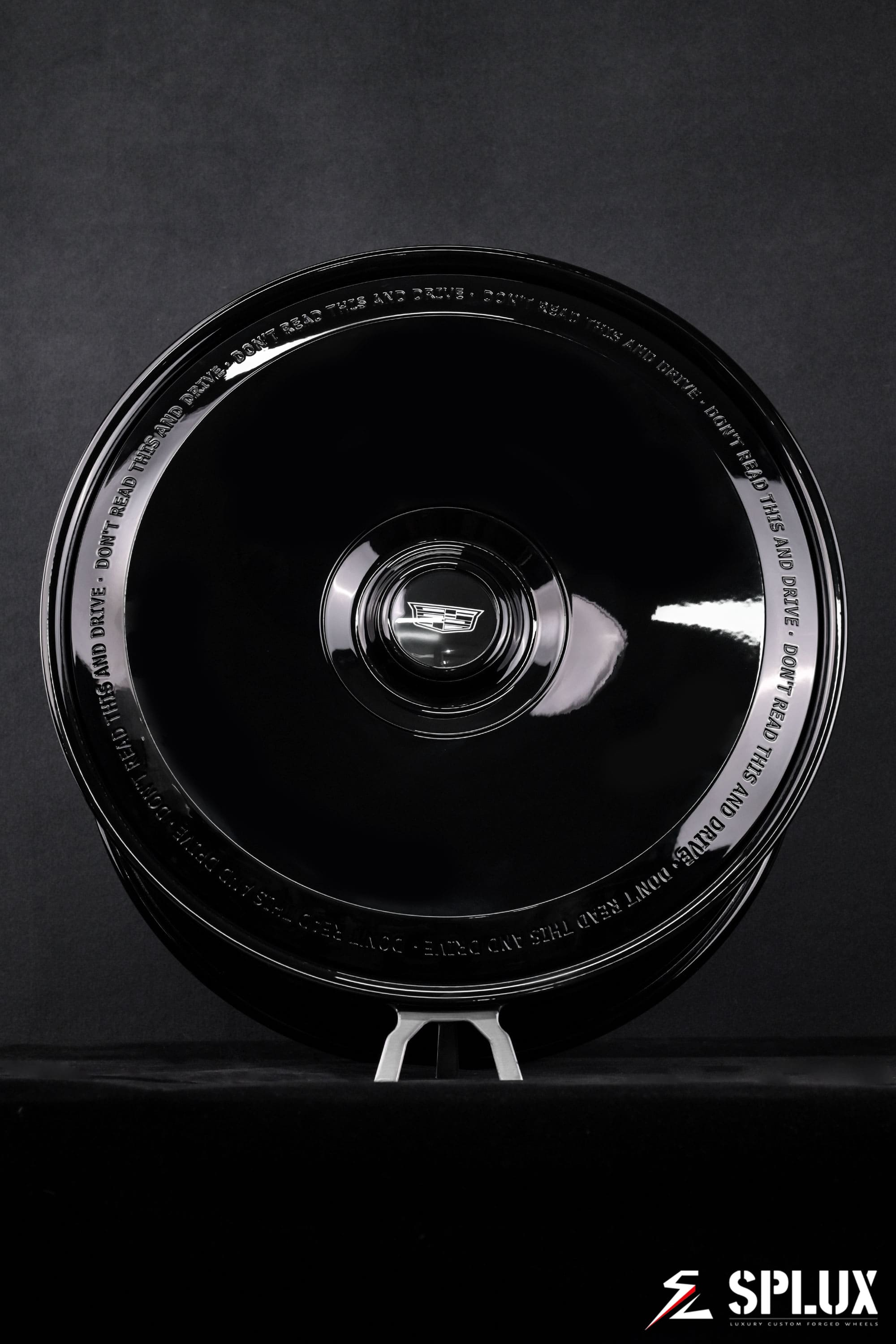 Cadillac Escalade 24 inch rims showing the custom full coverage floating center cap