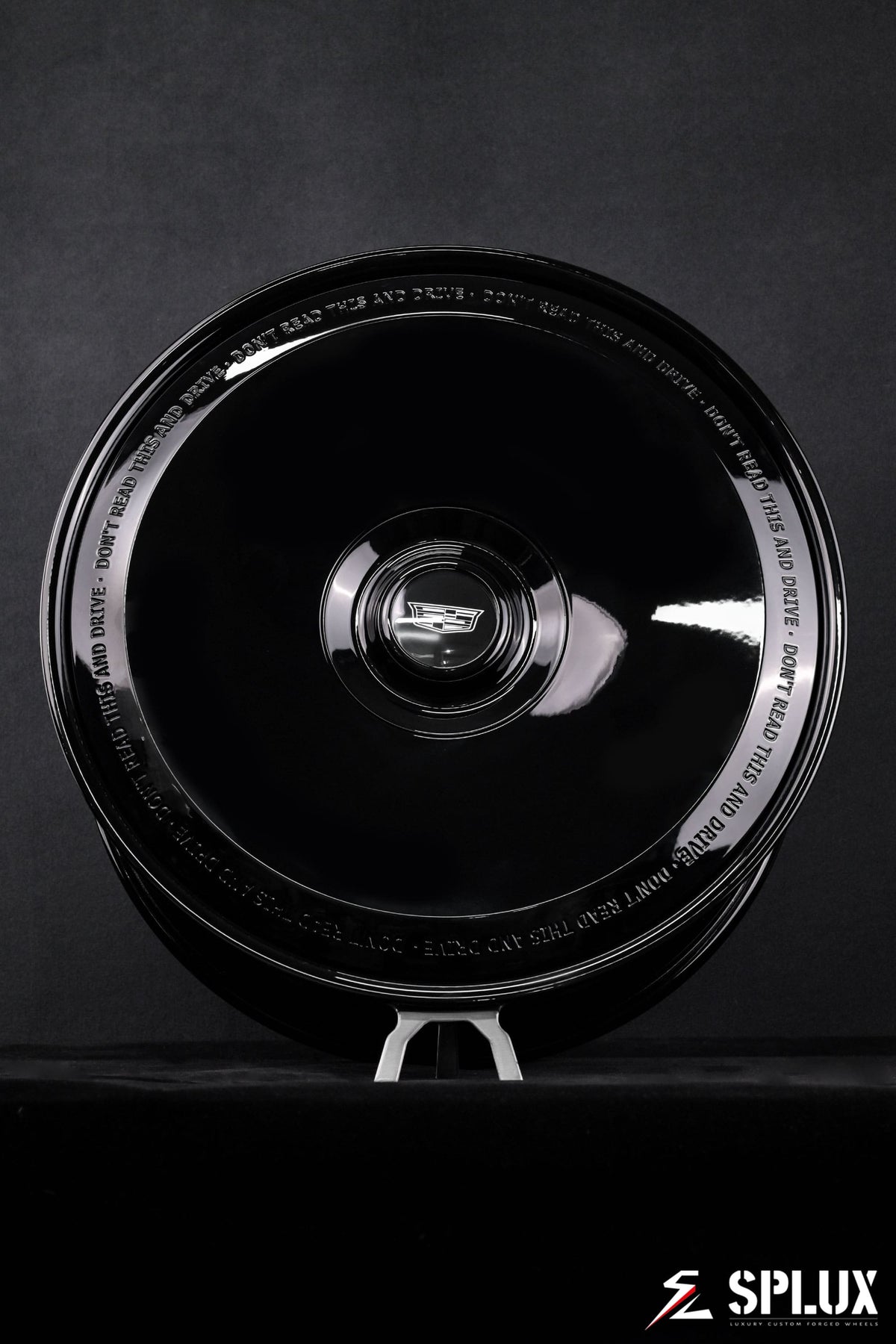 Cadillac Escalade 24 inch rims showing the custom full coverage floating center cap