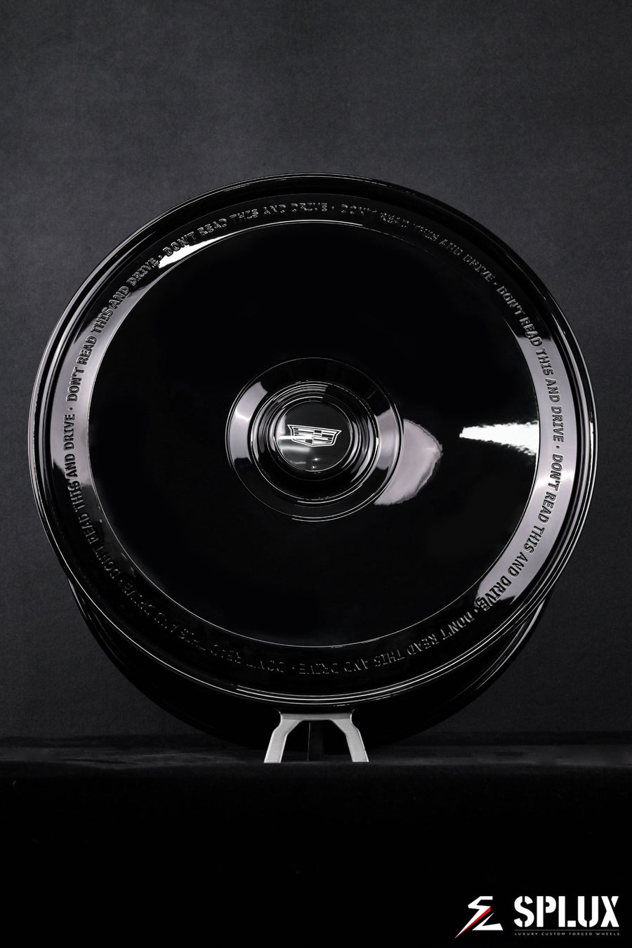 Cadillac Escalade 24 inch rims showing the custom full coverage floating center cap