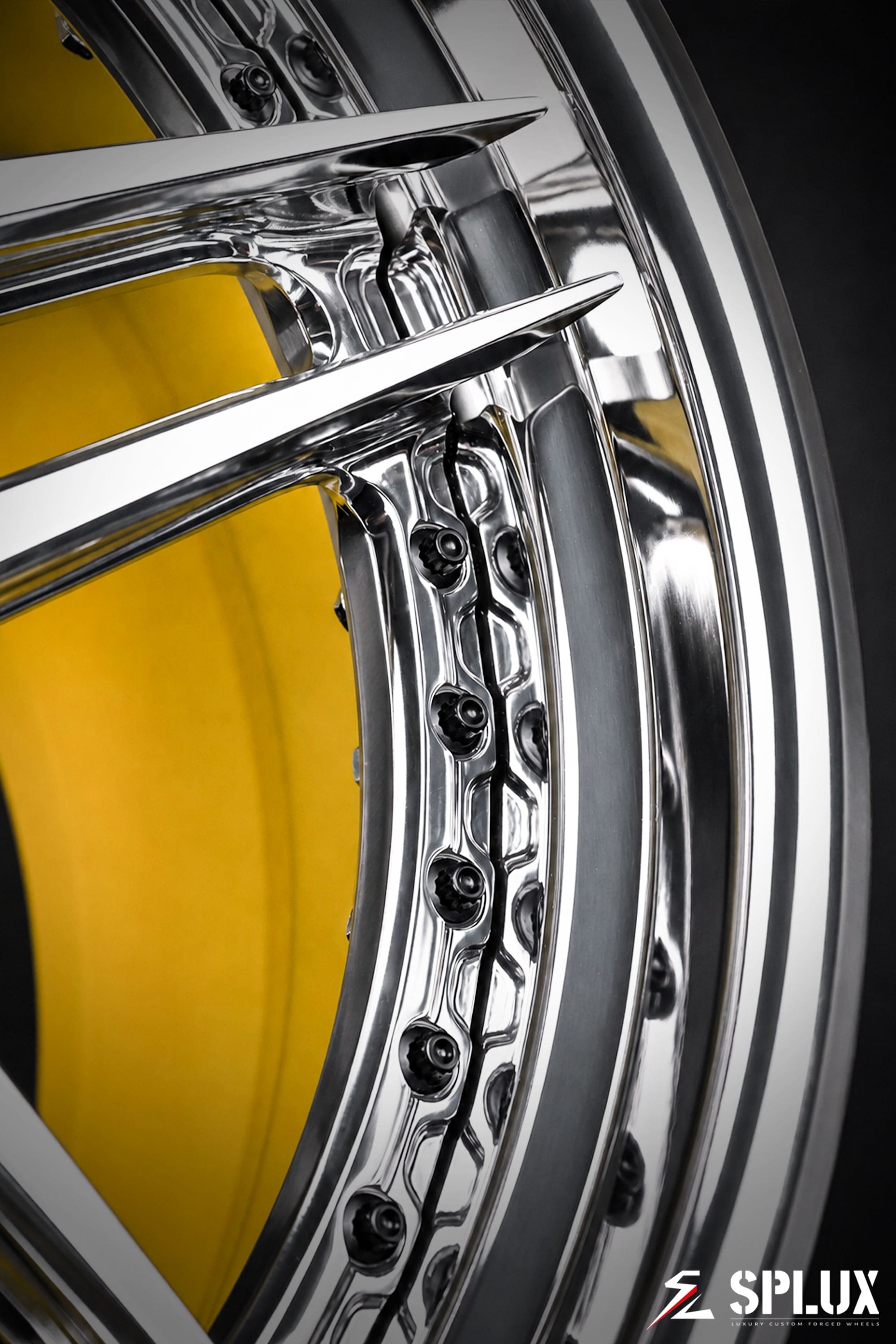 Close-up of the SA-01 forged wheel showing polished aluminum spokes and gloss yellow inner barrel