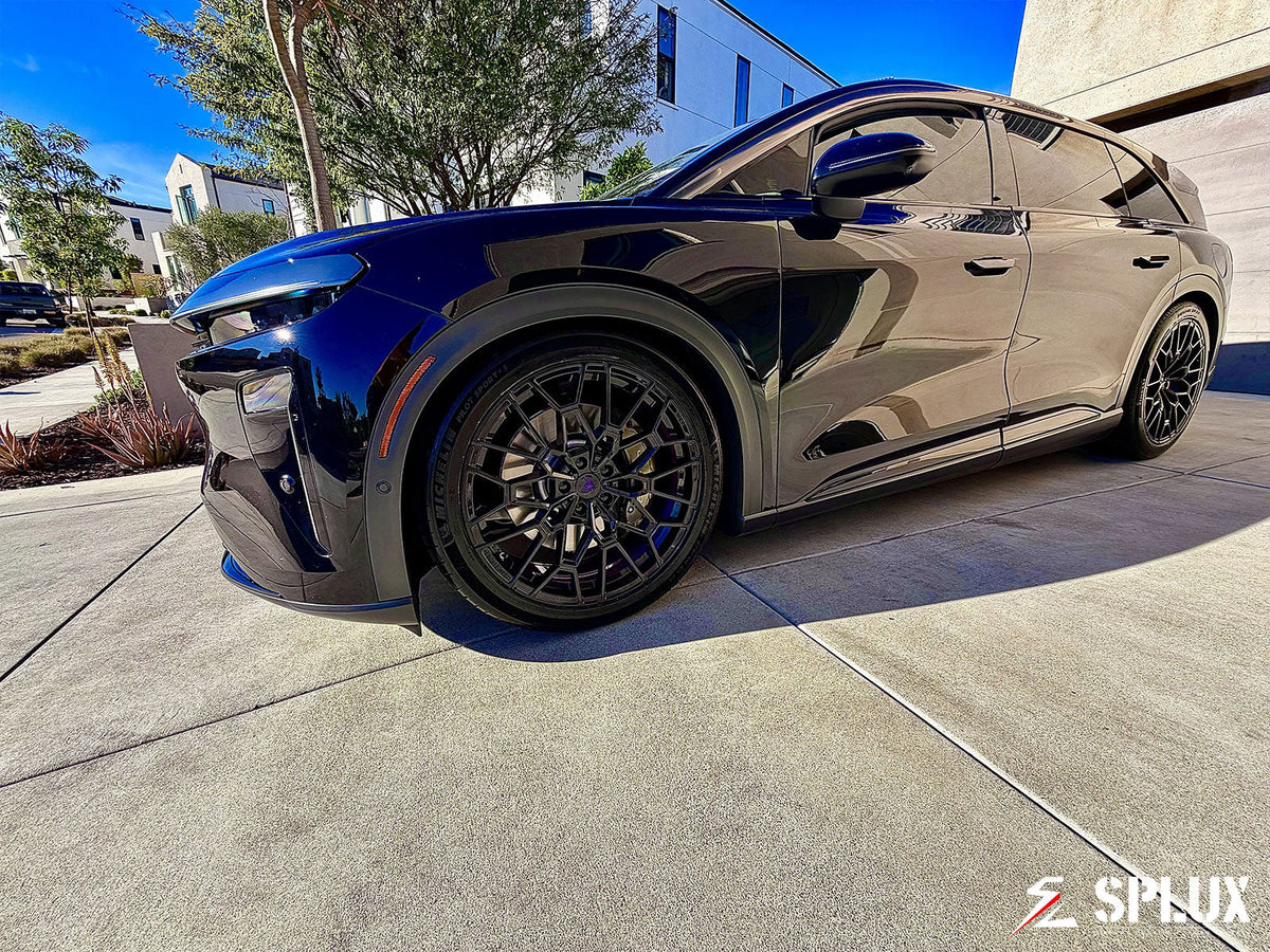 Lucid Gravity wheels showing piano black spokes and brushed purple inner barrel detail