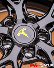 tesla model s wheels full vehicle gallery shot with black and yellow rims